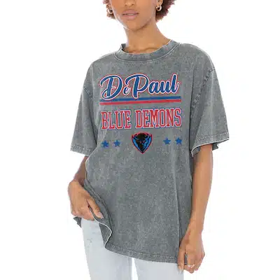 Person wearing a loose-fitting gray DePaul Blue Demons t-shirt with red and blue lettering and a small blue demon logo, paired with light jeans.