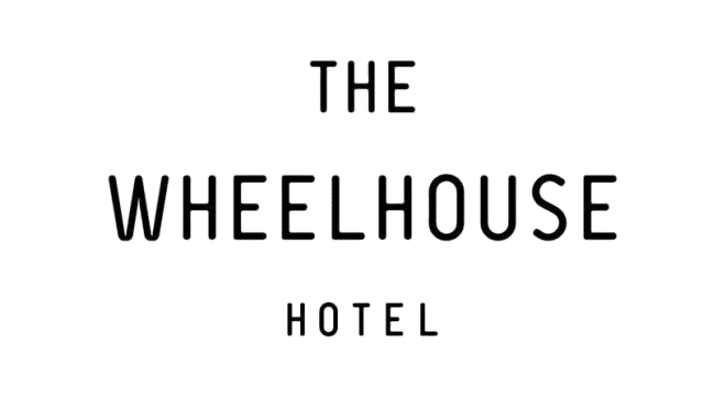 the-wheelhouse-hotel-logo (1) (1) Black text on a white background reads "The Wheelhouse Hotel" in uppercase, minimalist font.