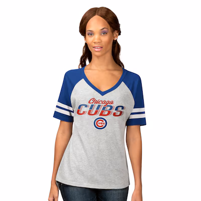 cubs-womens-tshirts Woman wearing a gray and blue Chicago Cubs T-shirt with short sleeves and team logo on the front, standing against a white background.