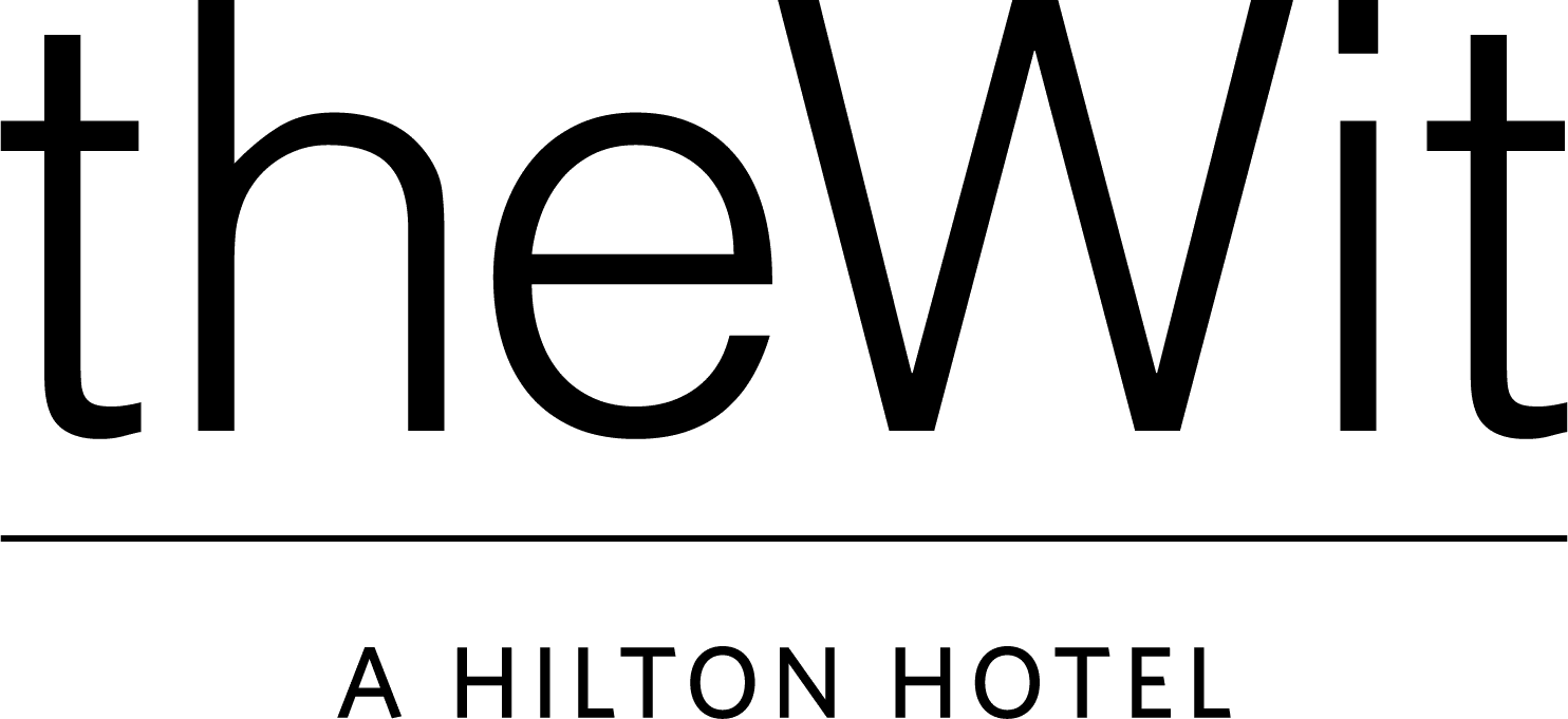 Logo for "theWit" with the tagline "A Hilton Hotel" displayed in black text on a light background.